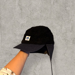 Trapper Russian cap black fleece and navy ear flaps.