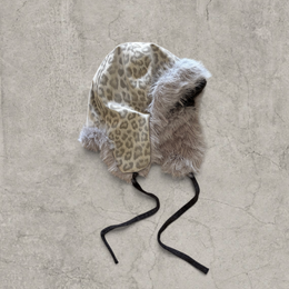 Russian trapper bonnet hat in grey silver animal leopard print with grey fur.