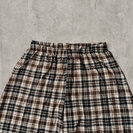 Wide leg checkered plaid trousers with elasticated waist in brown.