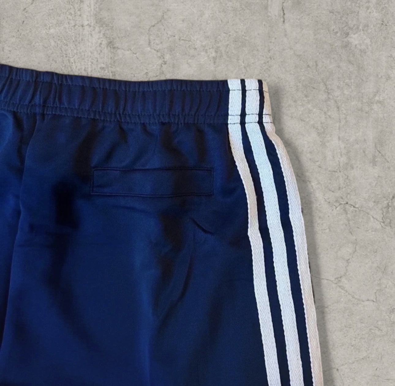 Baggy relaxed fit trousers with white stripes in dark blue