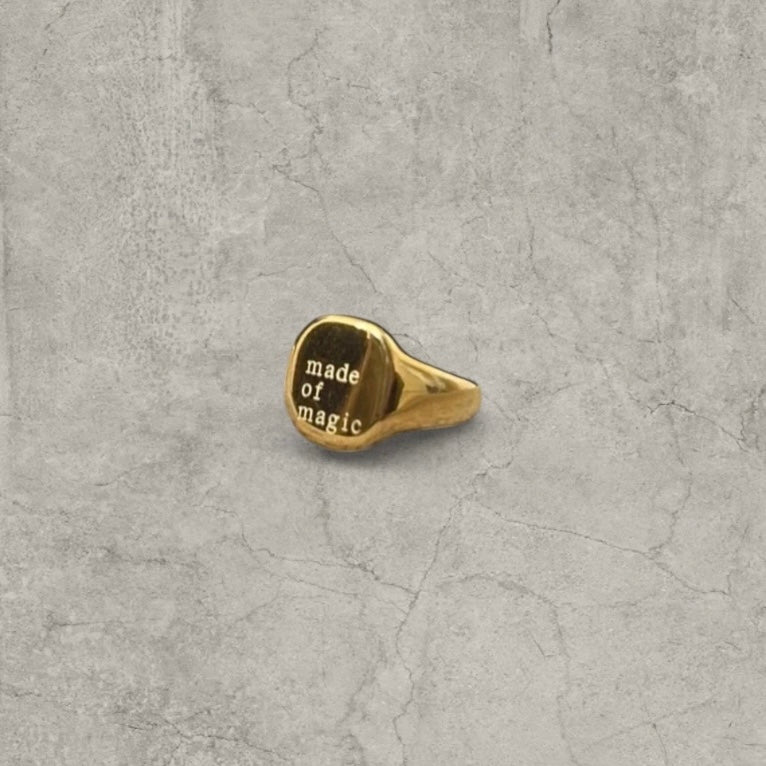 Vintage style gold colour stainless steel signet ring with made of magic engraving