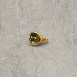 Vintage style gold colour stainless steel signet ring with made of magic engraving