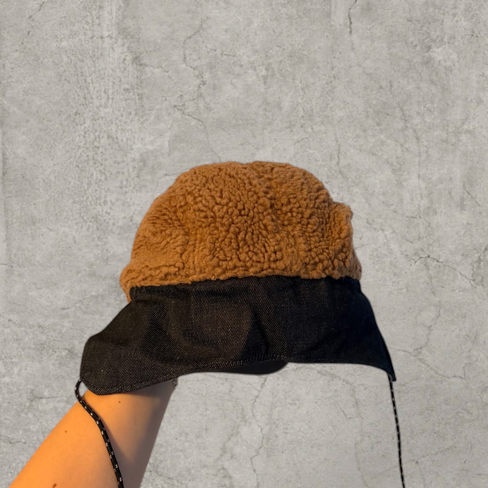 Trapper Russian cap brown/beige fleece and grey ear flaps.