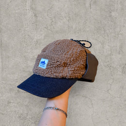 Trapper Russian cap brown/beige fleece and grey ear flaps.