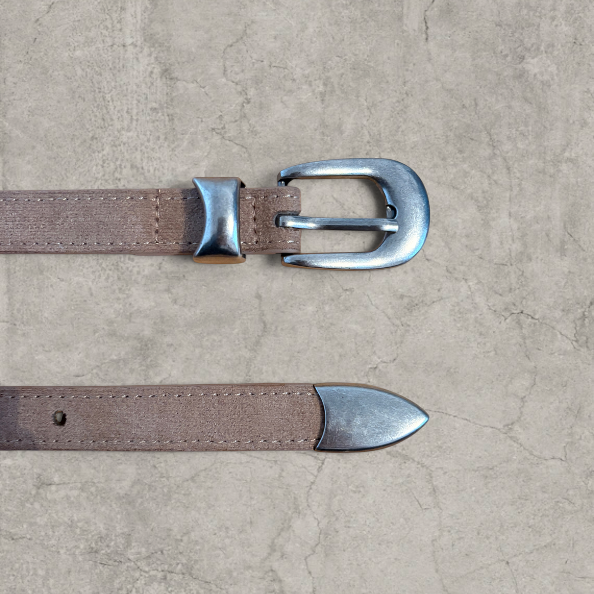 Smart tailored formal belt in beige with silver trim.