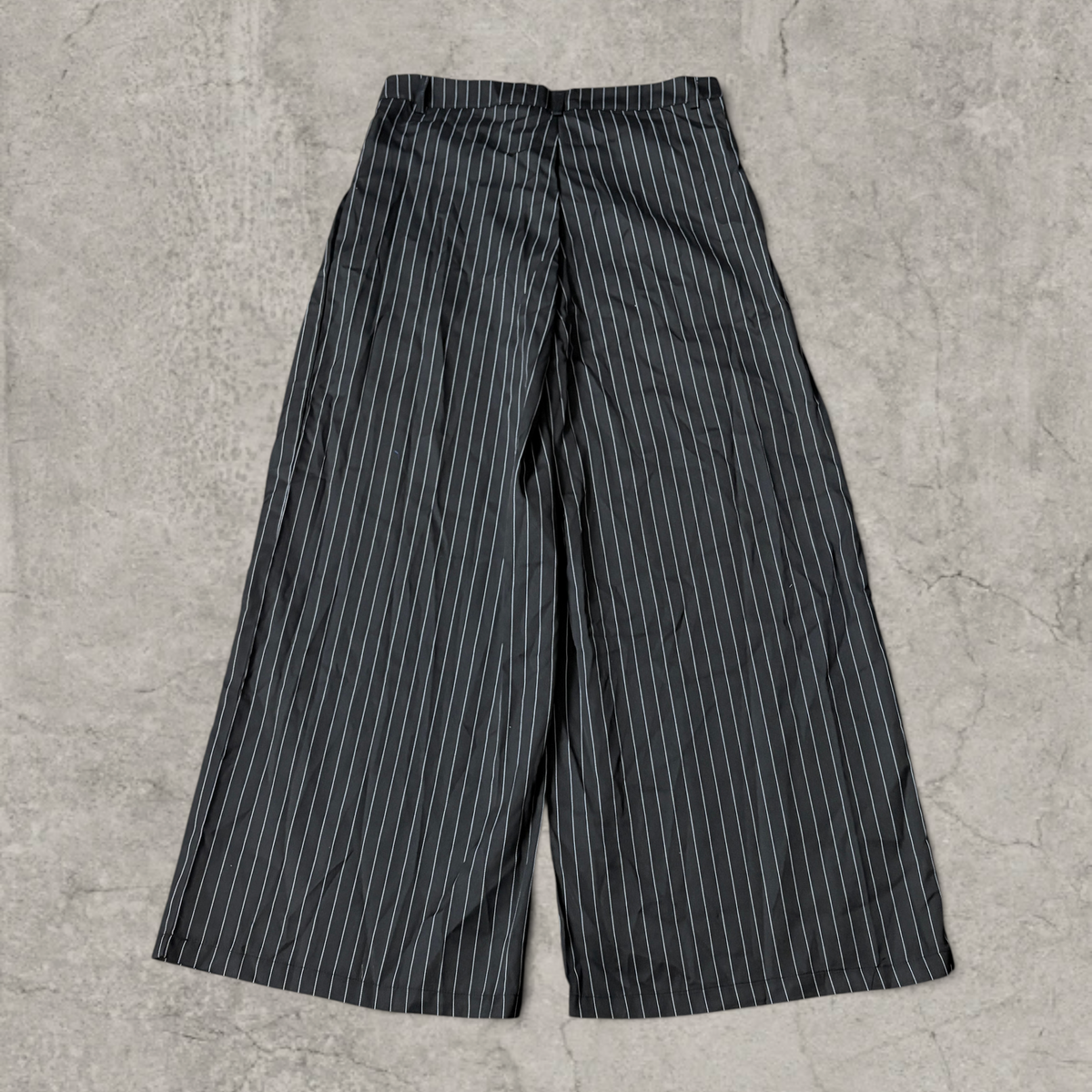 Wide-leg pinstriped tailored trousers in black with white pinstripe
