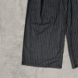 Wide-leg pinstriped tailored trousers in black with white pinstripe