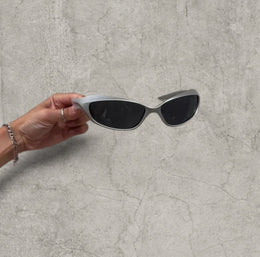 Wrap-around UV400 sunglasses in silver, black lenses one size