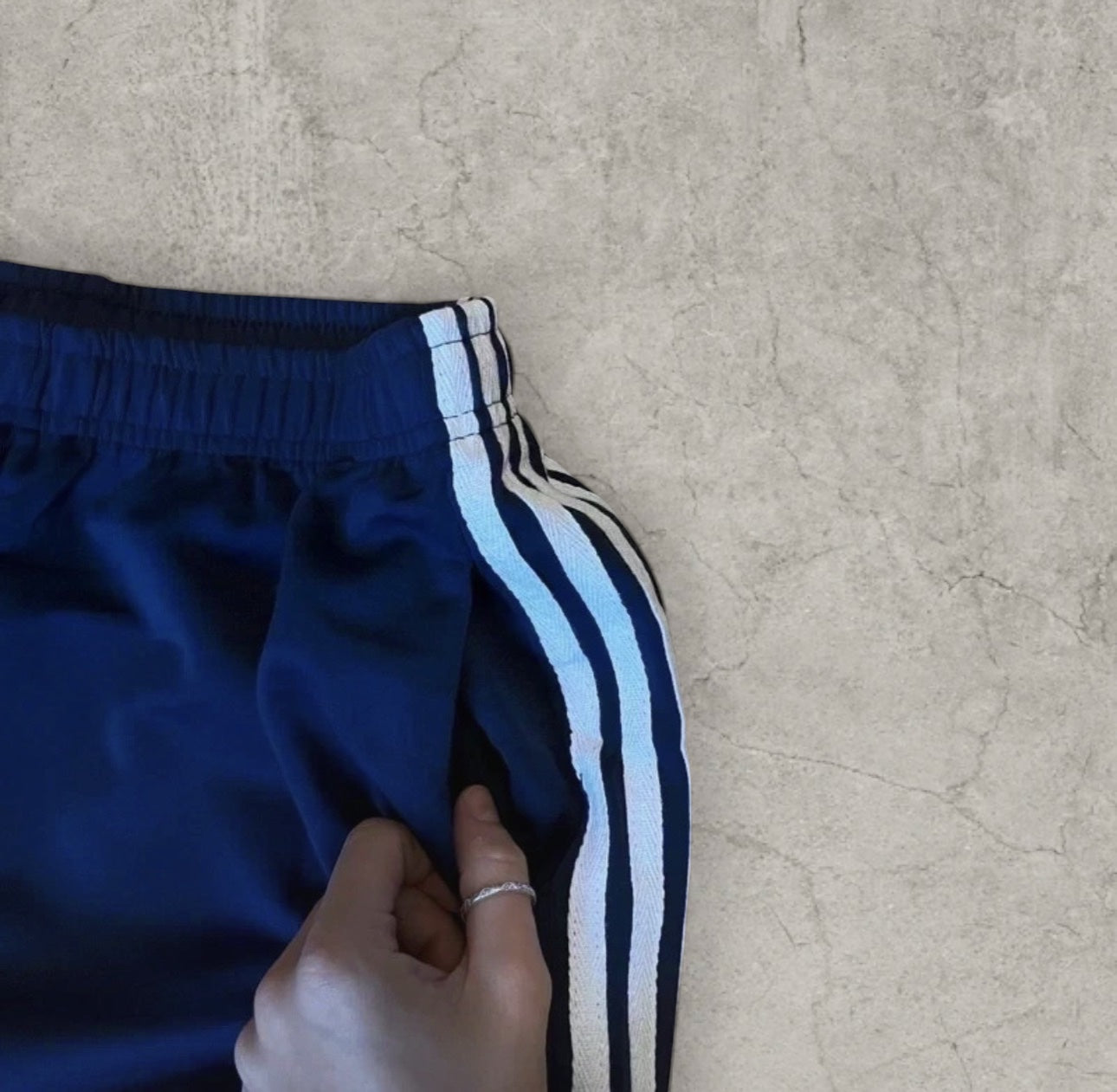 Baggy relaxed fit trousers with white stripes in dark blue