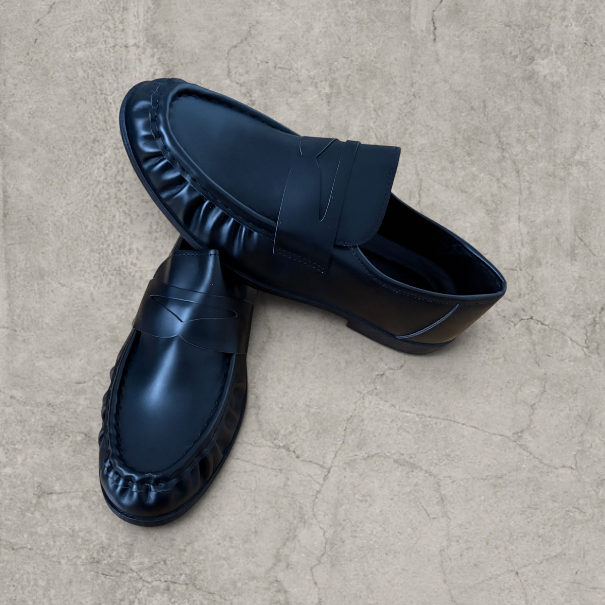 Faux leather penny dress loafers shoes in black.