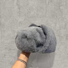 Russian ushanka hat in grey faux fur.