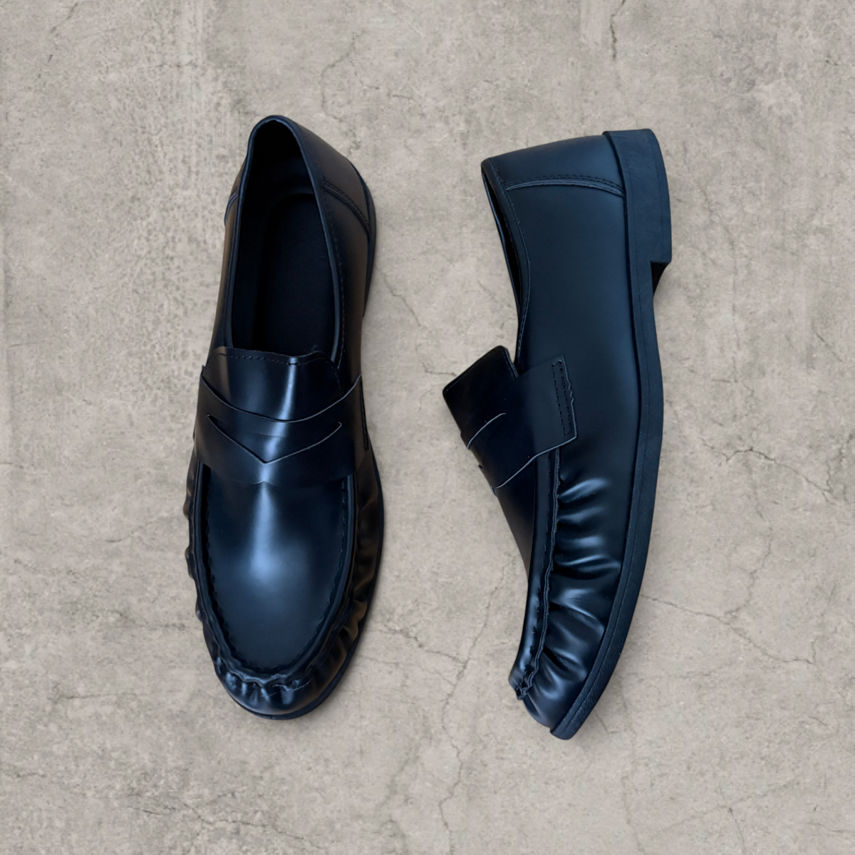 Faux leather penny dress loafers shoes in black.