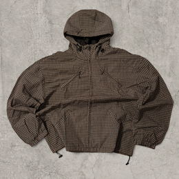 Black and brown checkered gorpcore jacket hood and zip.