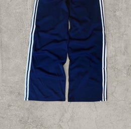 Baggy relaxed fit trousers with white stripes in dark blue