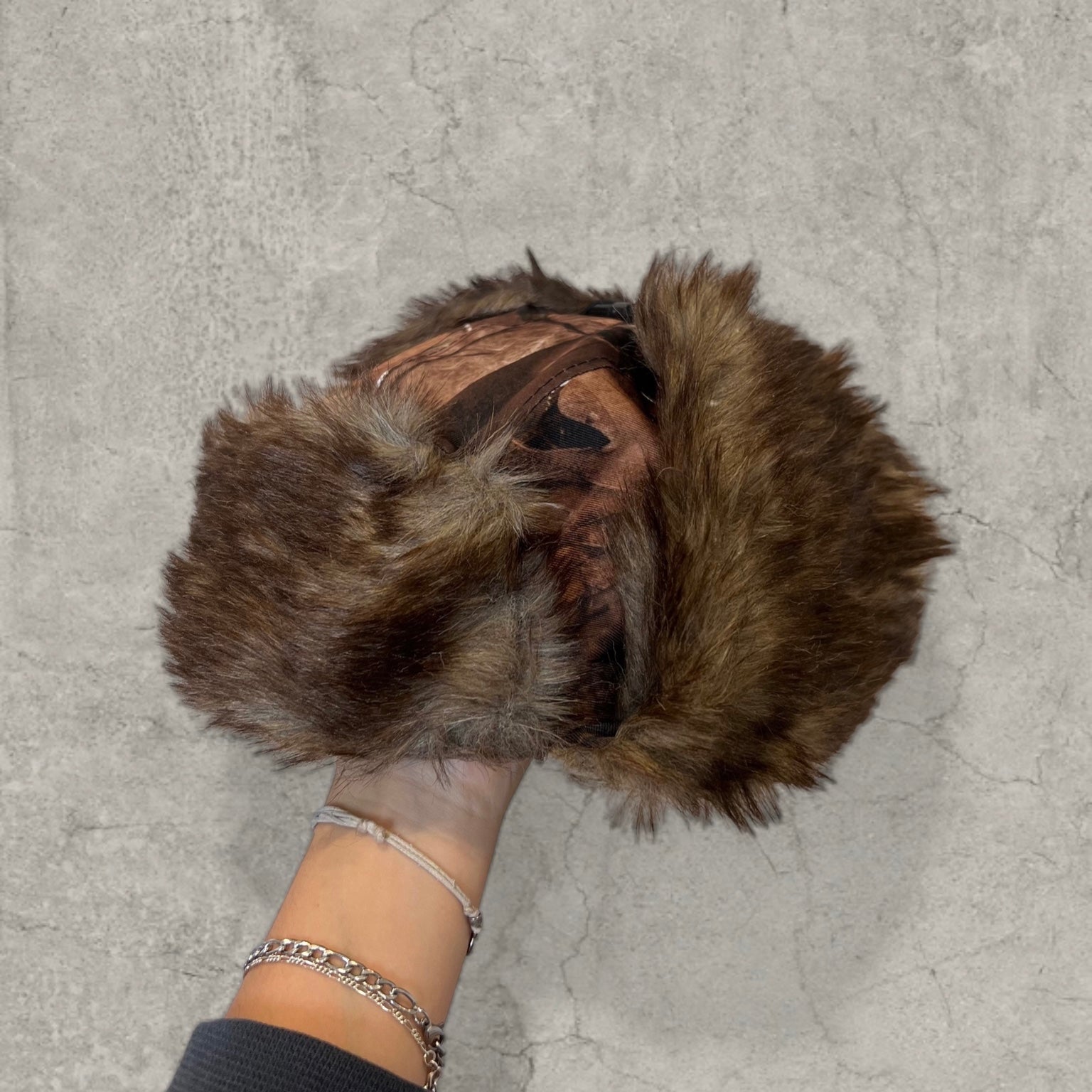 Russian ushanka hat in brown camo tree print with faux fur.