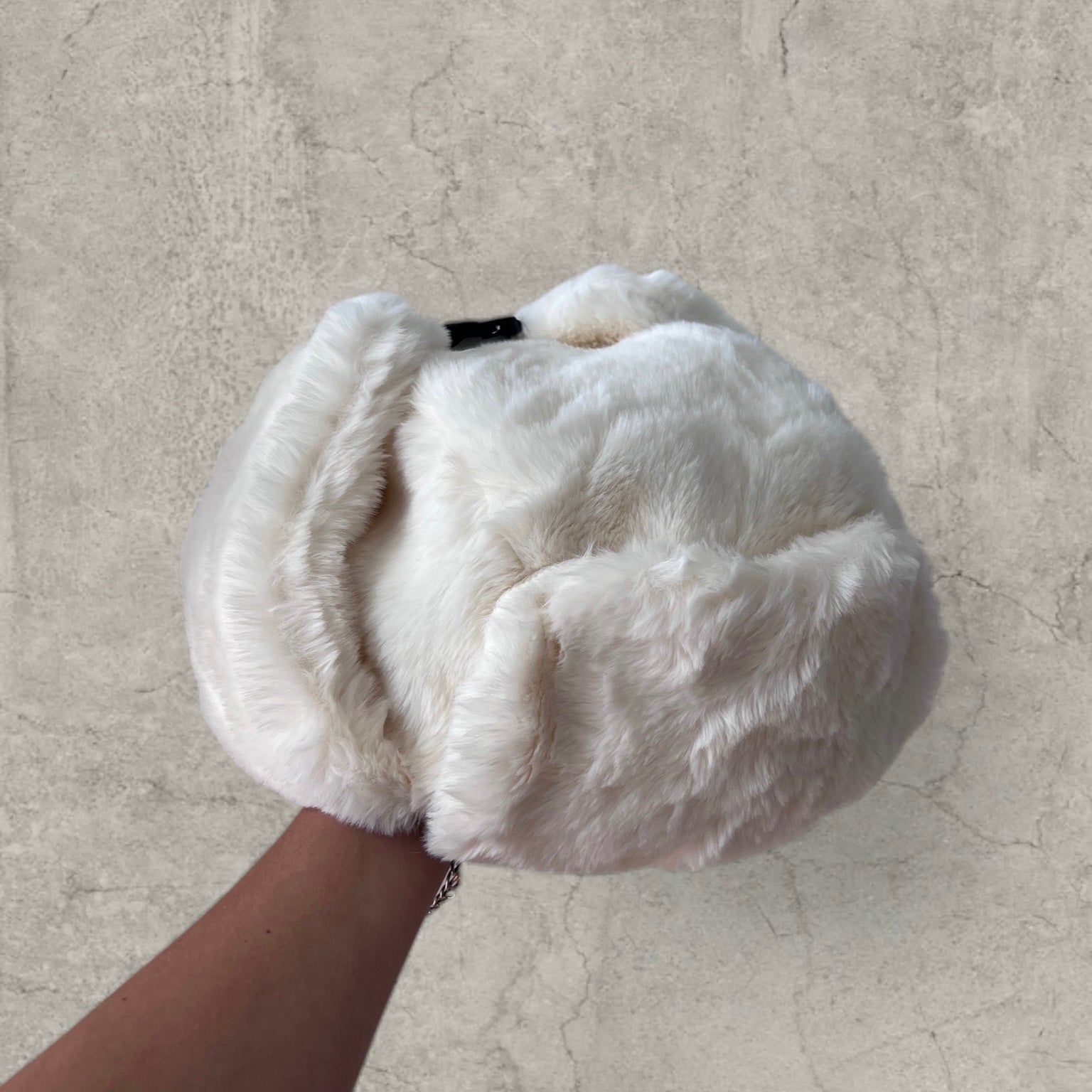 Russian ushanka hat in white/cream faux fur.