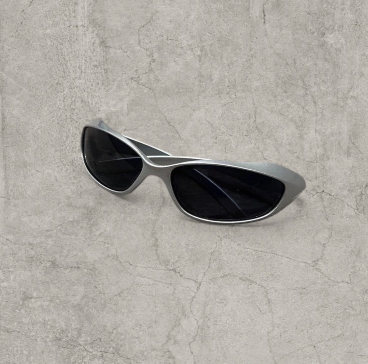 Wrap-around UV400 sunglasses in silver, black lenses one size