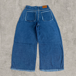 Wide-leg skater jeans in washed blue with raw hem.