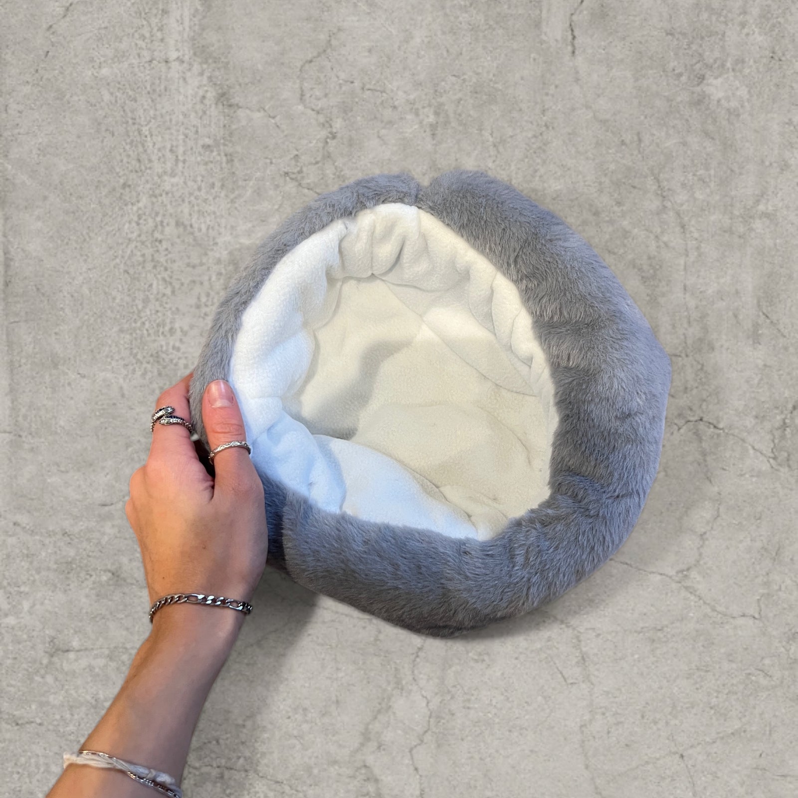 Russian ushanka hat in grey faux fur.