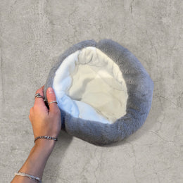 Russian ushanka hat in grey faux fur.