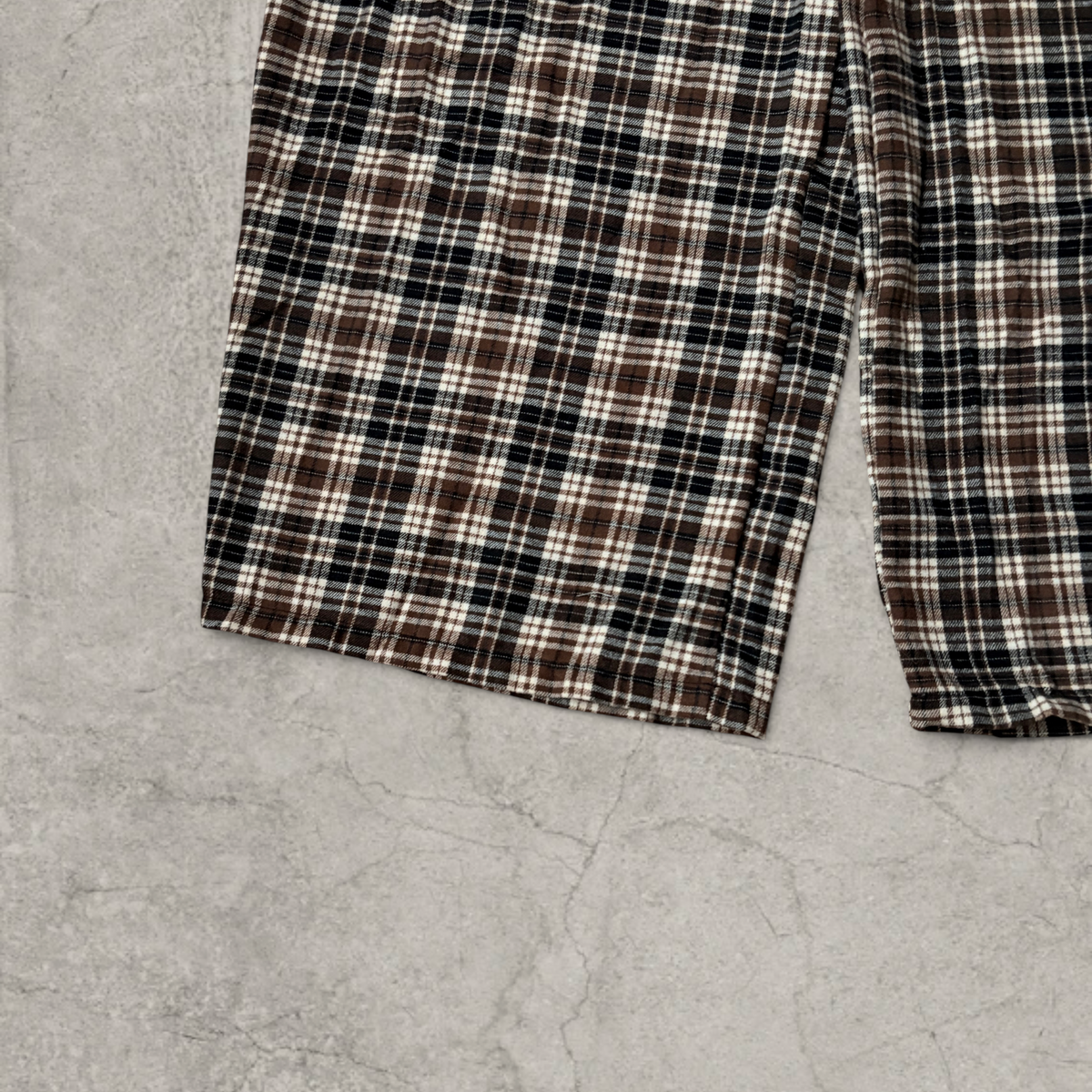 Wide leg checkered plaid trousers with elasticated waist in brown.