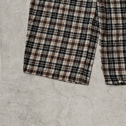 Wide leg checkered plaid trousers with elasticated waist in brown.