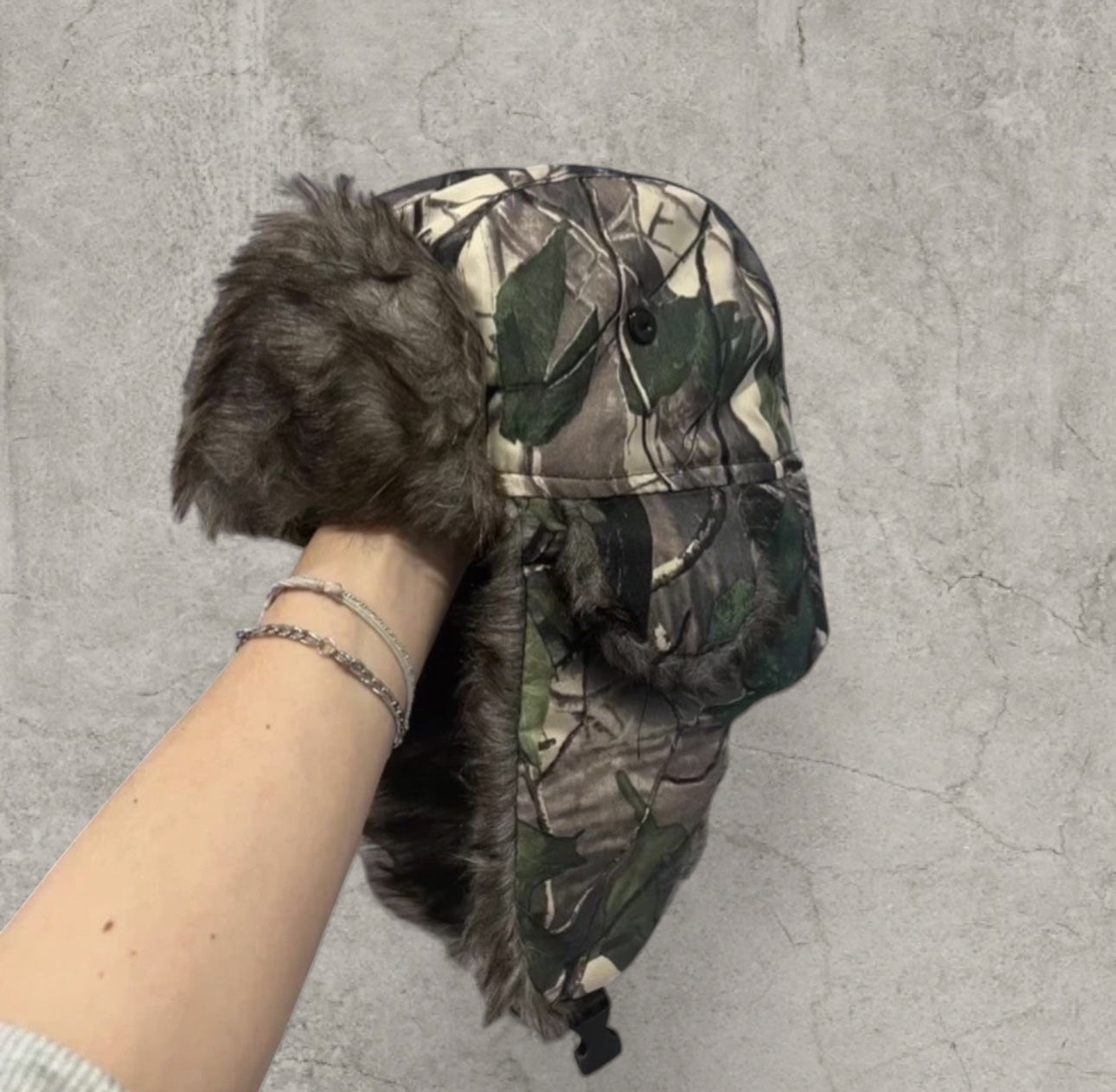 Russian ushanka hat in khaki camo tree print with faux fur.