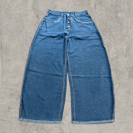 Wide-leg skater jeans in washed blue with raw hem.