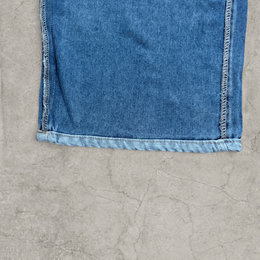 Wide-leg skater jeans in washed blue with raw hem.