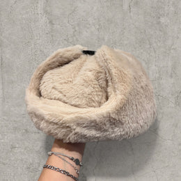 Russian ushanka hat in cream/apricot faux fur.