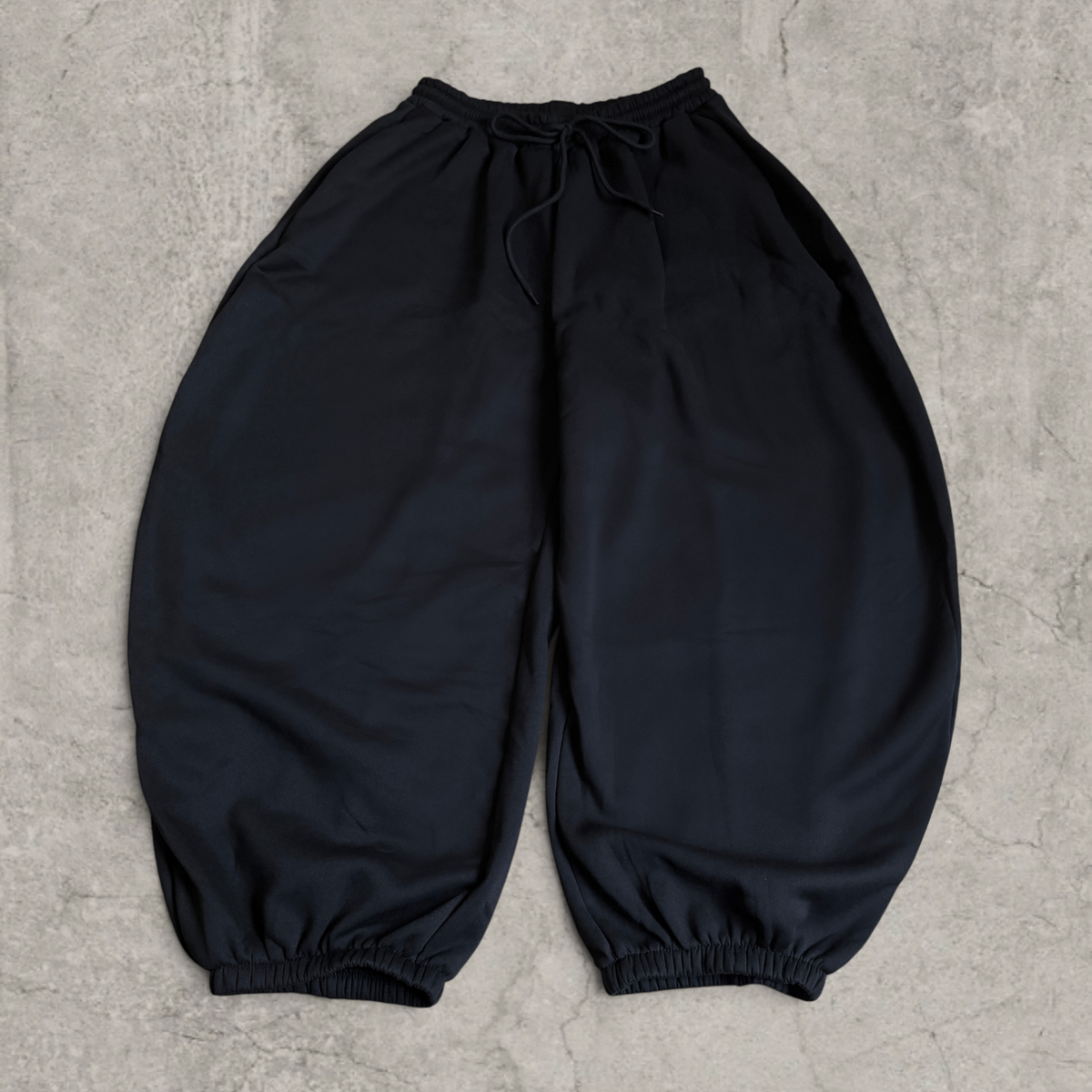 Super baggy wide leg Korean joggers in black.