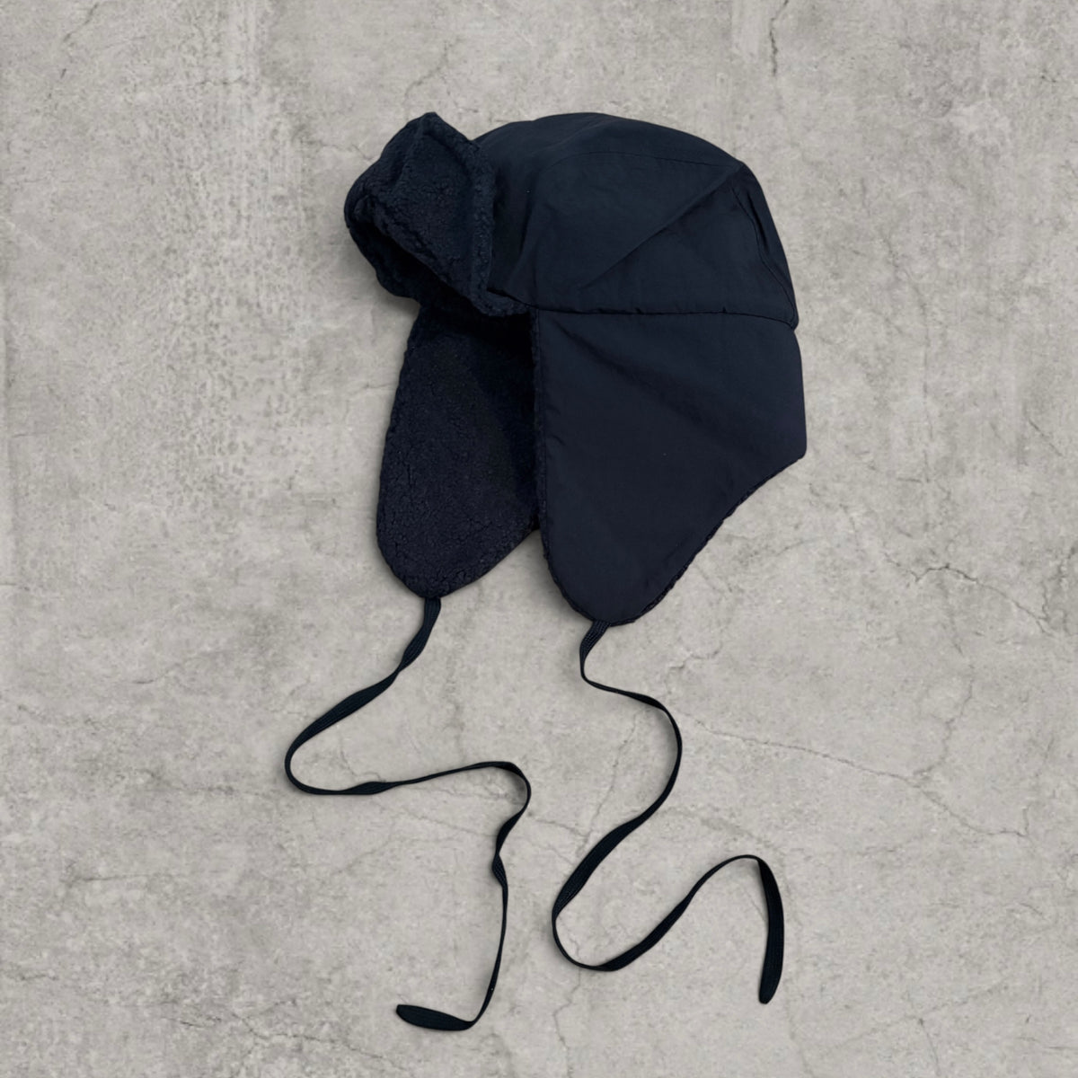 Russian trapper bonnet hat in black with black fleece.