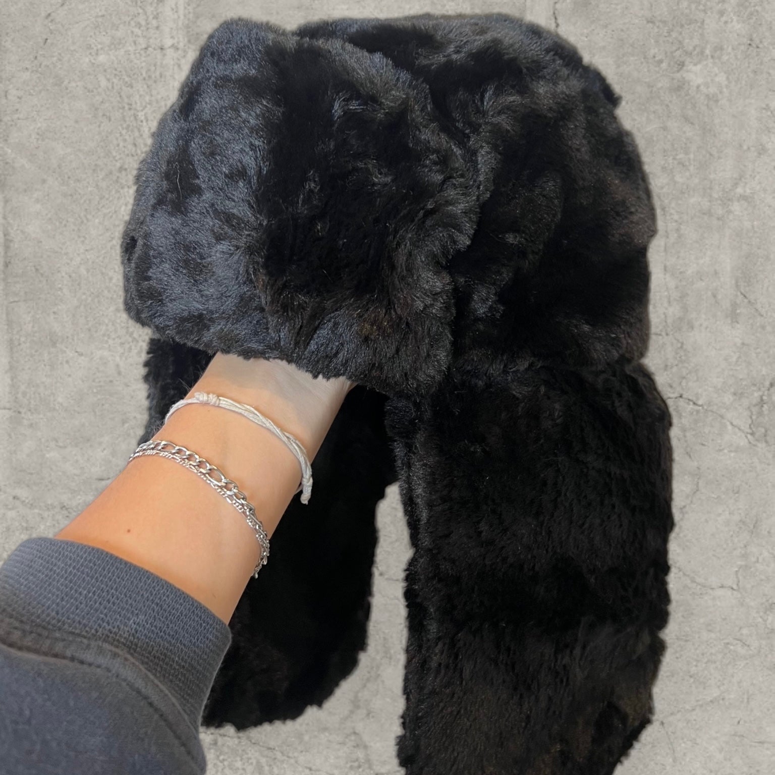 Russian ushanka hat in black faux fur.
