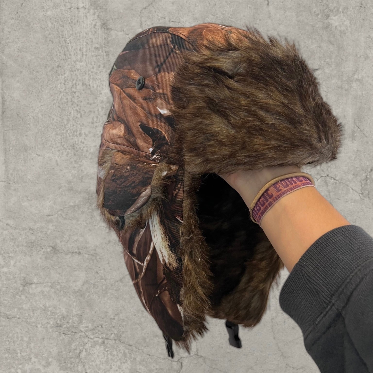 Russian ushanka hat in brown camo tree print with faux fur.