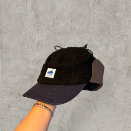 Trapper Russian cap black fleece and navy ear flaps.