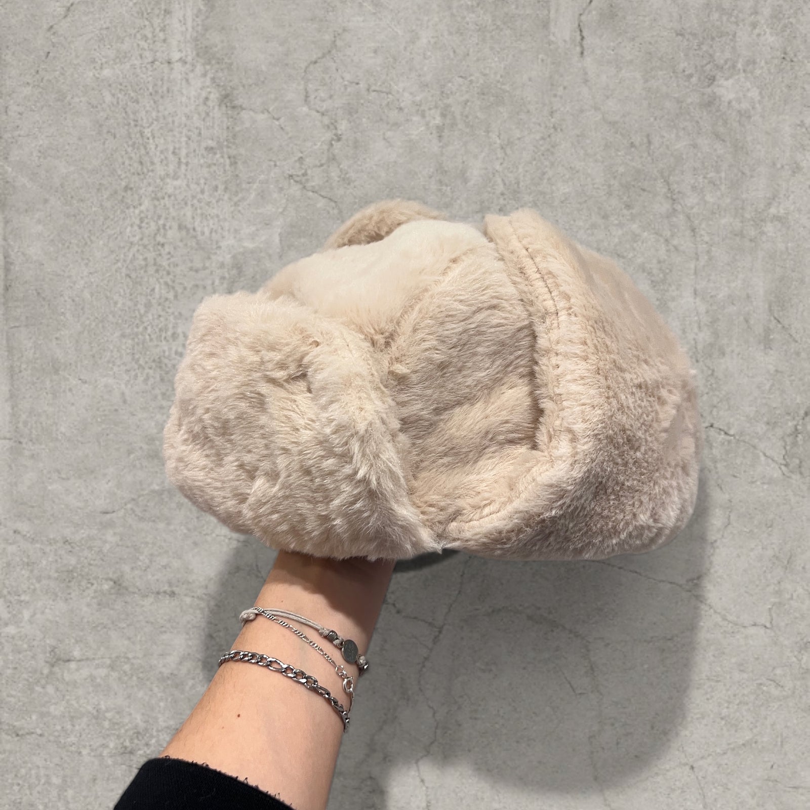 Russian ushanka hat in cream/apricot faux fur.