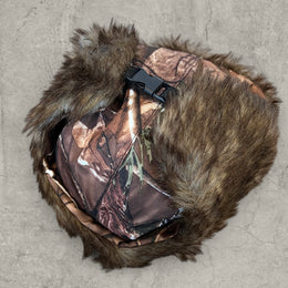 Russian ushanka hat in brown camo tree print with faux fur.