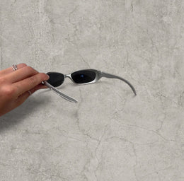 Wrap-around UV400 sunglasses in silver, black lenses one size