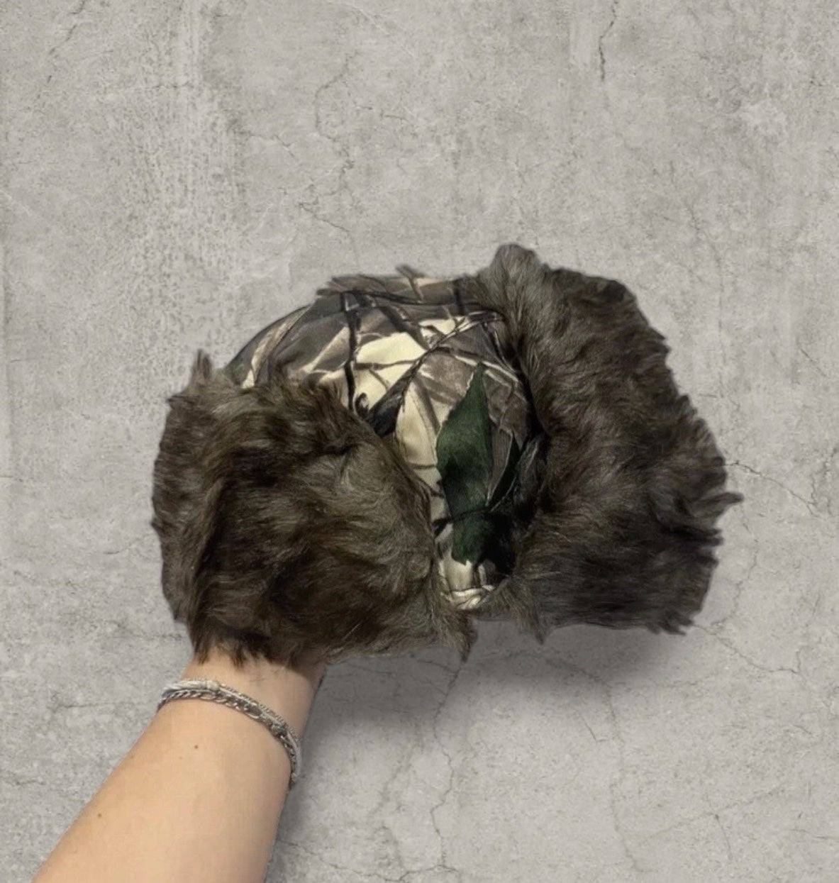 Russian ushanka hat in khaki camo tree print with faux fur.