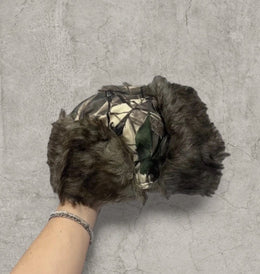 Russian ushanka hat in khaki camo tree print with faux fur.