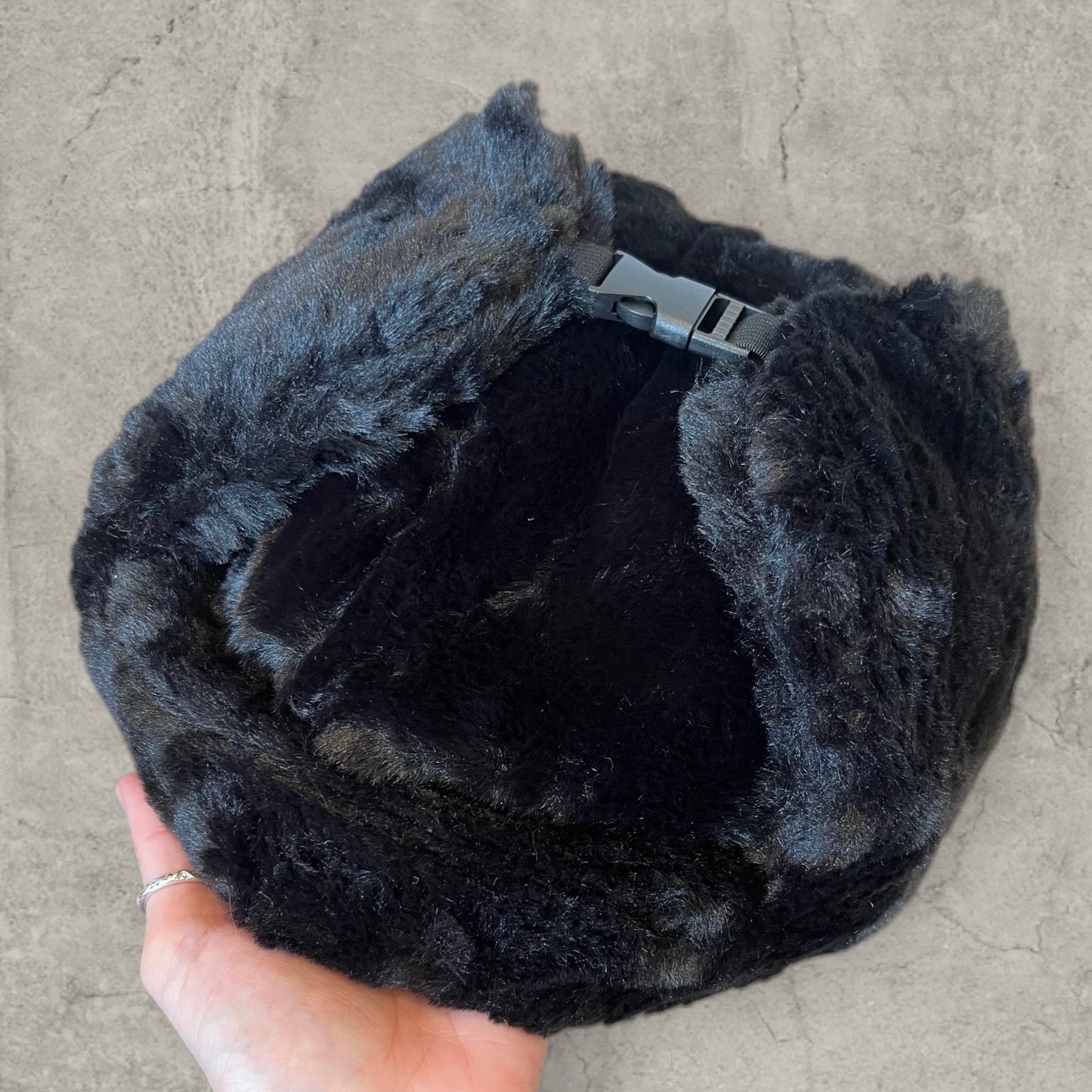 Russian ushanka hat in black faux fur.