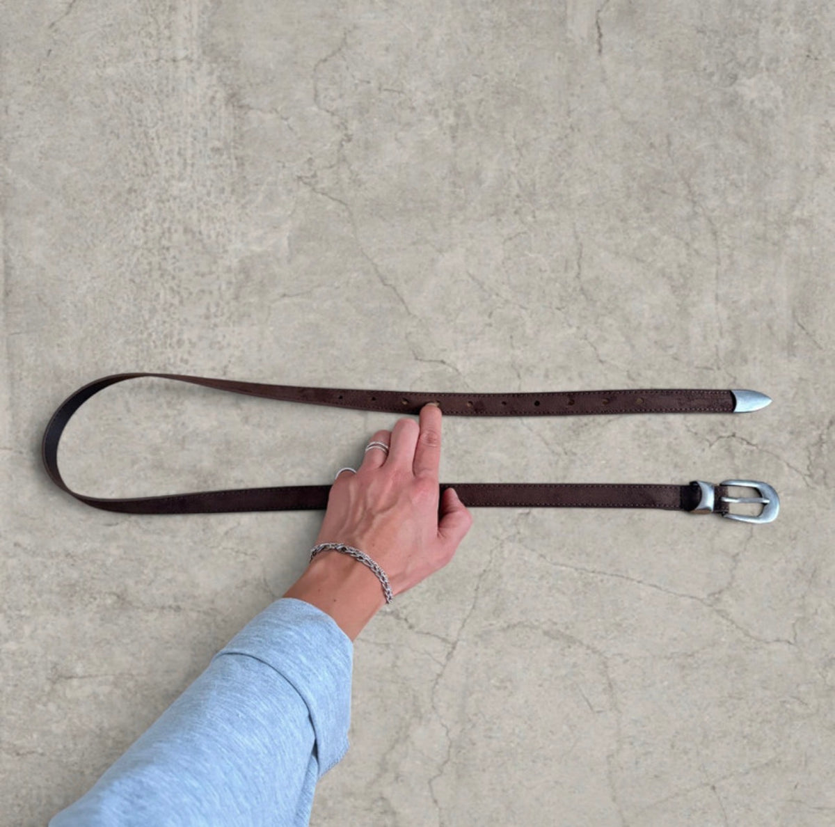 Smart tailored formal belt in brown with silver trim.