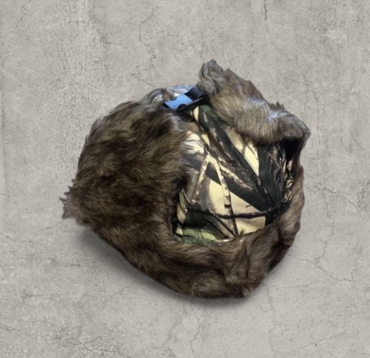 Russian ushanka hat in khaki camo tree print with faux fur.