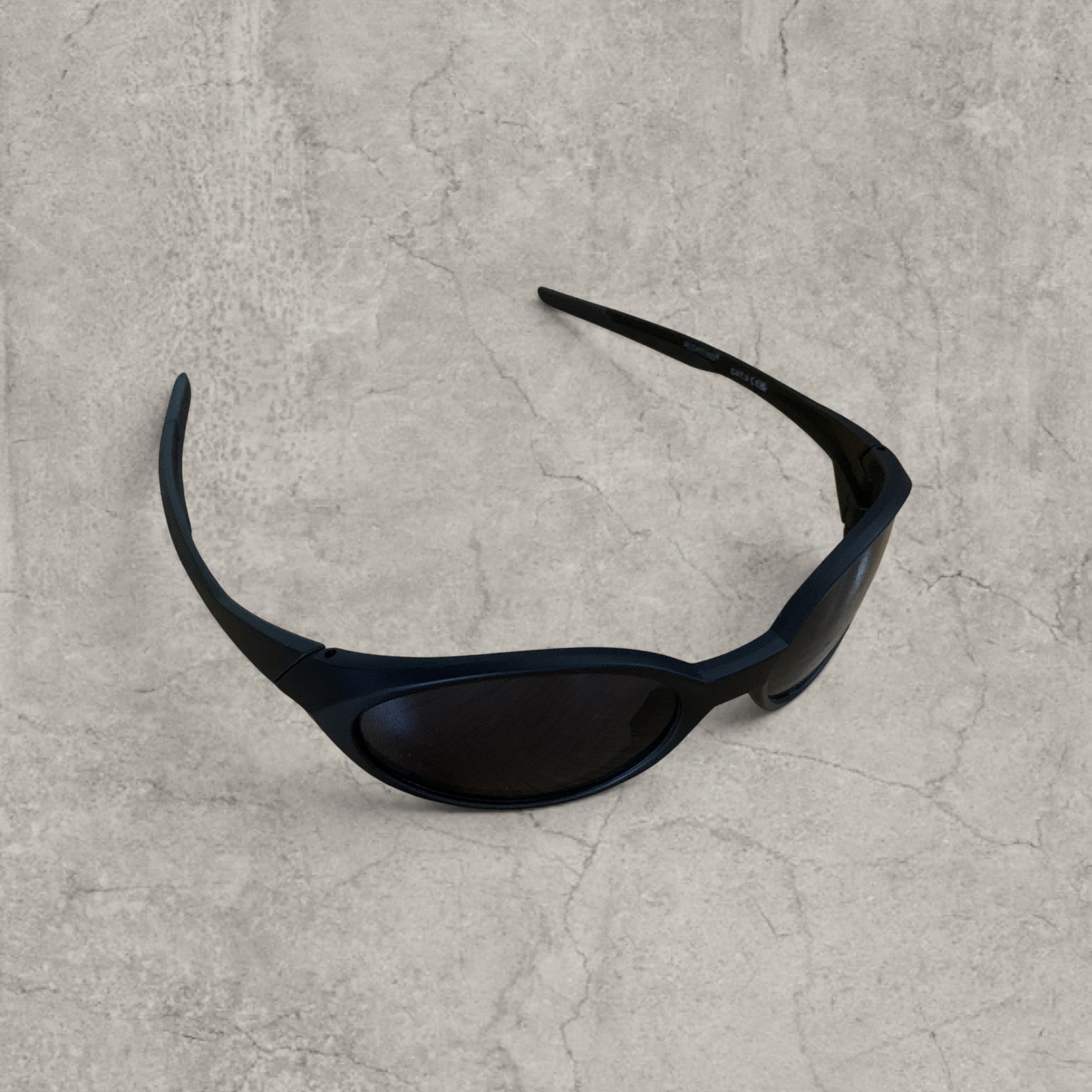 UV400 sunglasses with black lens in black frame.