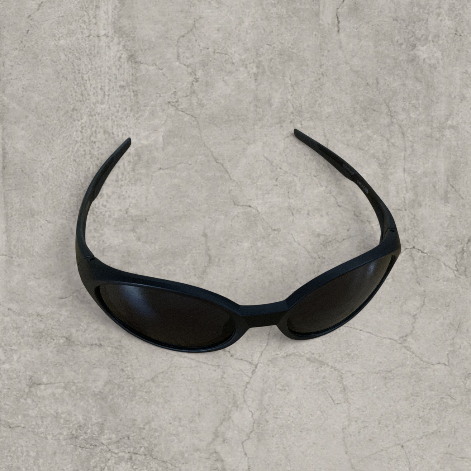 UV400 sunglasses with black lens in black frame.