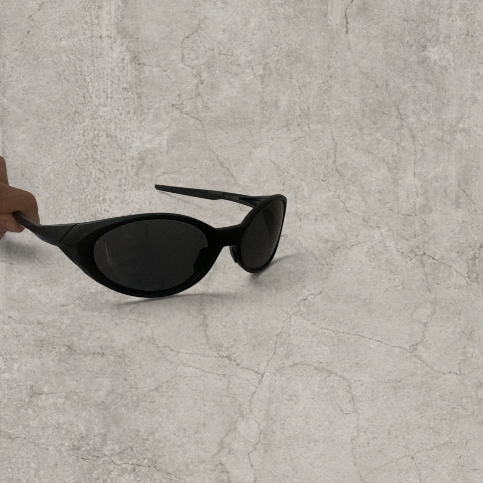 UV400 sunglasses with black lens in black frame.