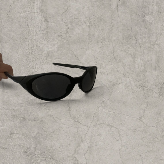 UV400 sunglasses with black lens in black frame.