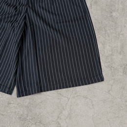 Baggy Japanese tailored shorts with pleats in black pinstripe