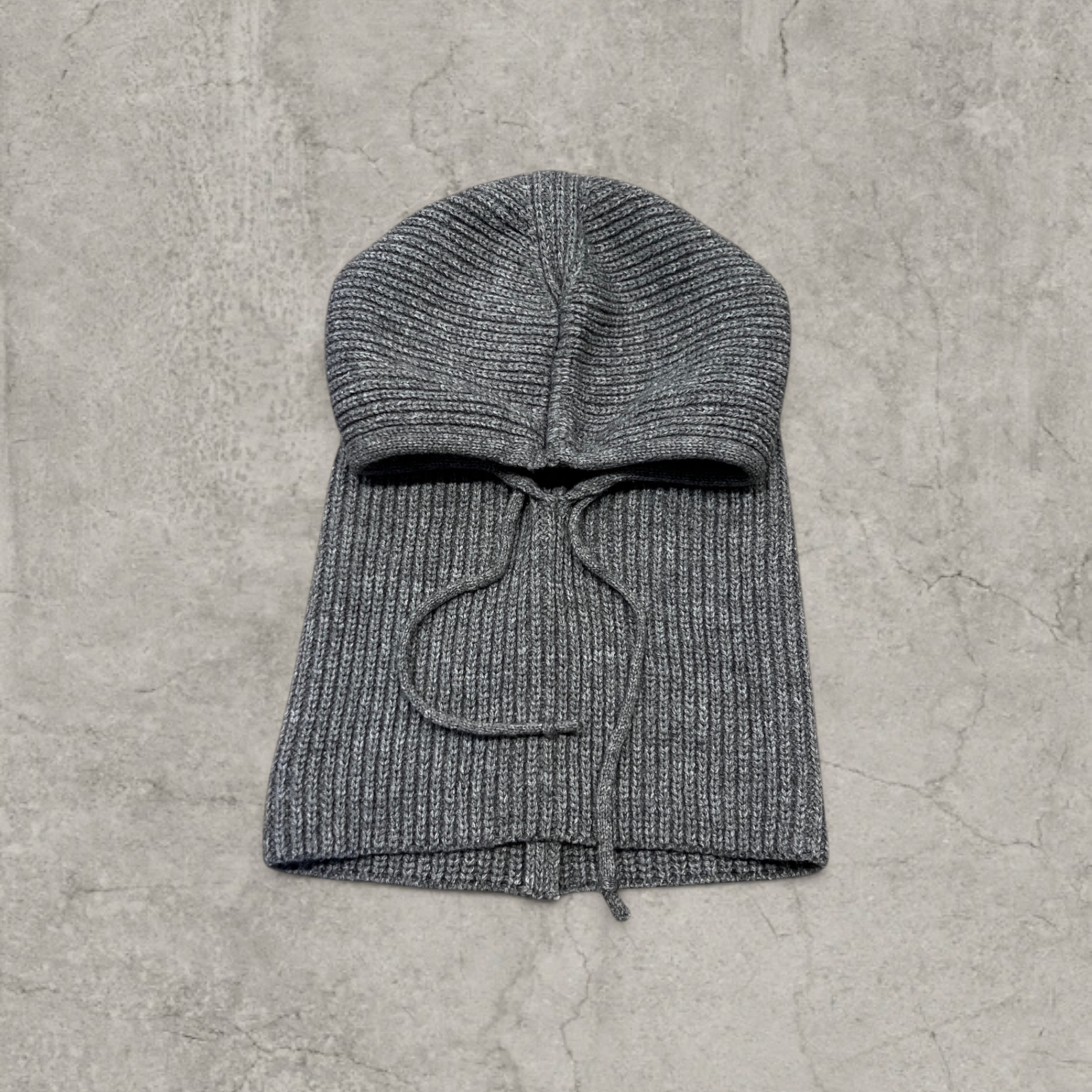 Grey knitted hooded snood scarf bonnet hat with drawstring.
