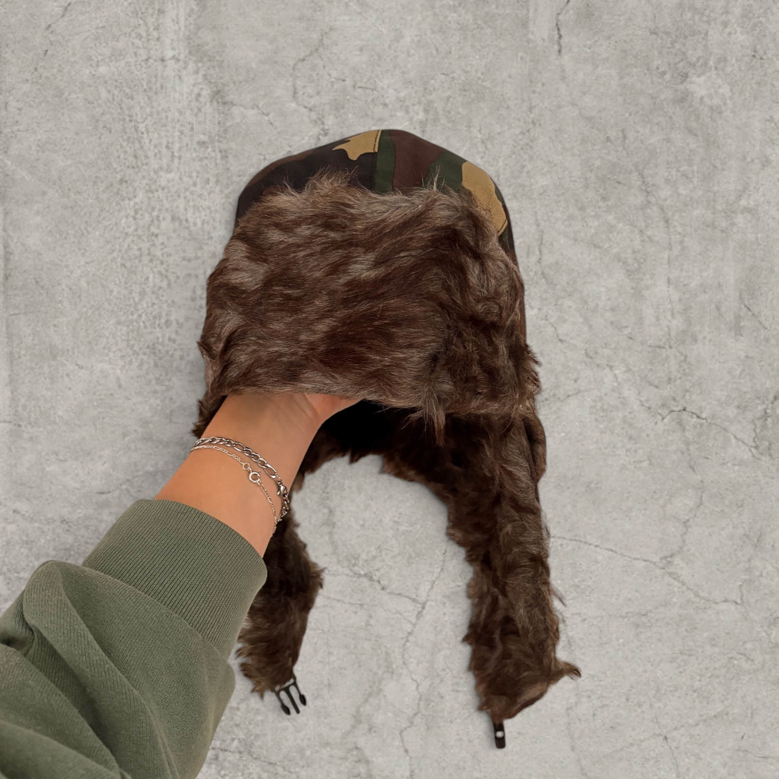 Russian ushanka hat in khaki camo print with faux fur.